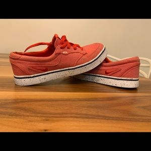 Nike red canvas lifestyle shoes.